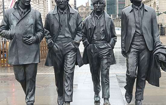 Metal statues of the Beatles in situ on a Liverpool street