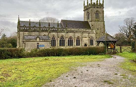 A path leads up to a church (St Mary Magdalene's Church, Battlefield)