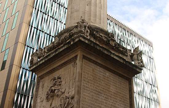A close up of the plinth of the monument to the Great Fire of London