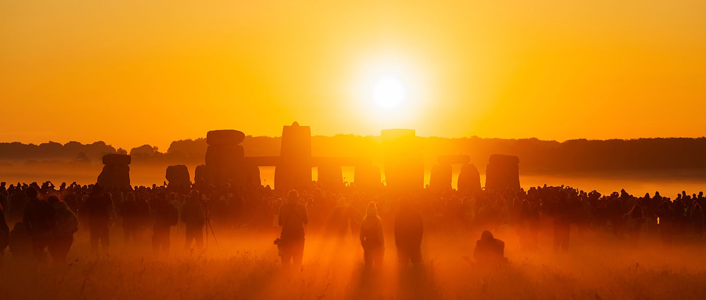 The sun rising over Stonehenge at summer solstice
