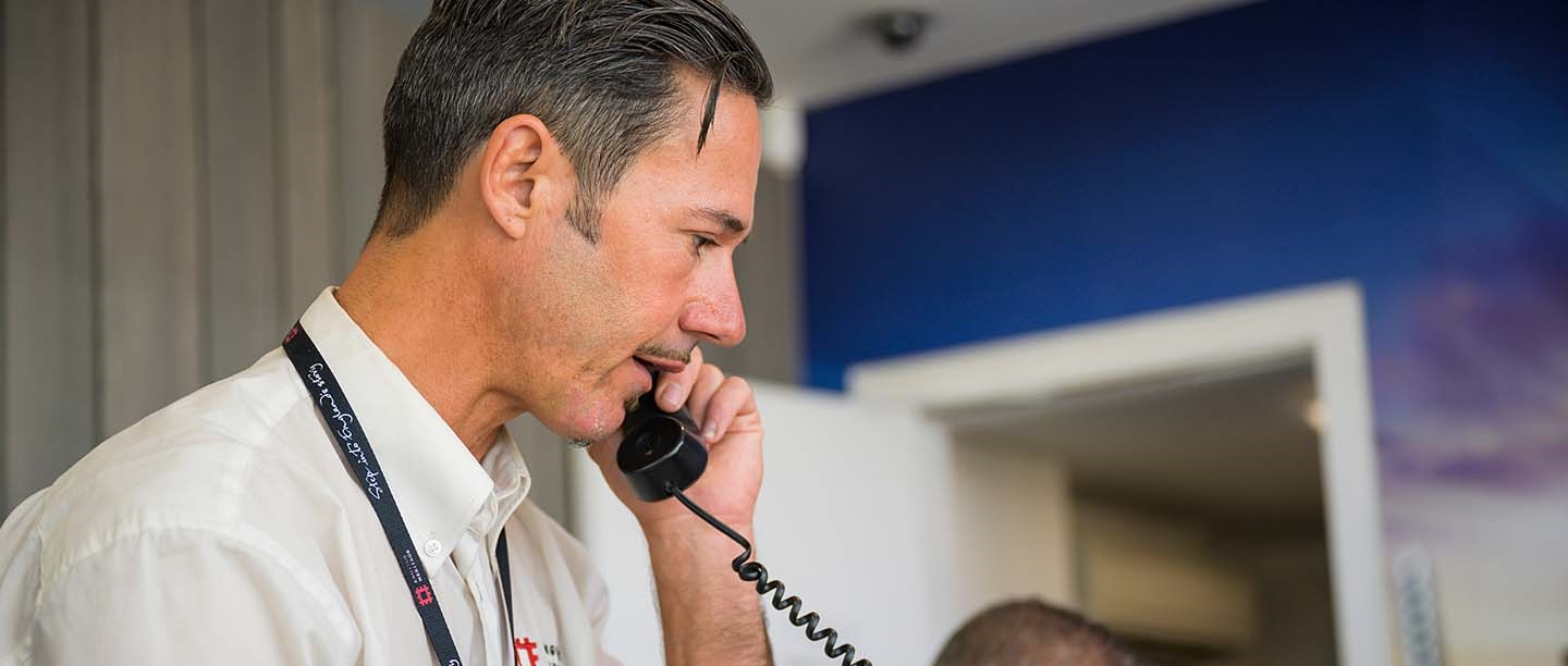 A member of staff speaks with customers on the phone