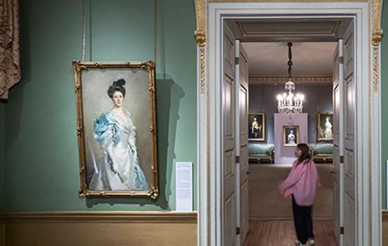 a young woman walks through a doorway which is next to a portrait (Mary Crowninshield Endicott Chamberlain by John Singer Sargent)