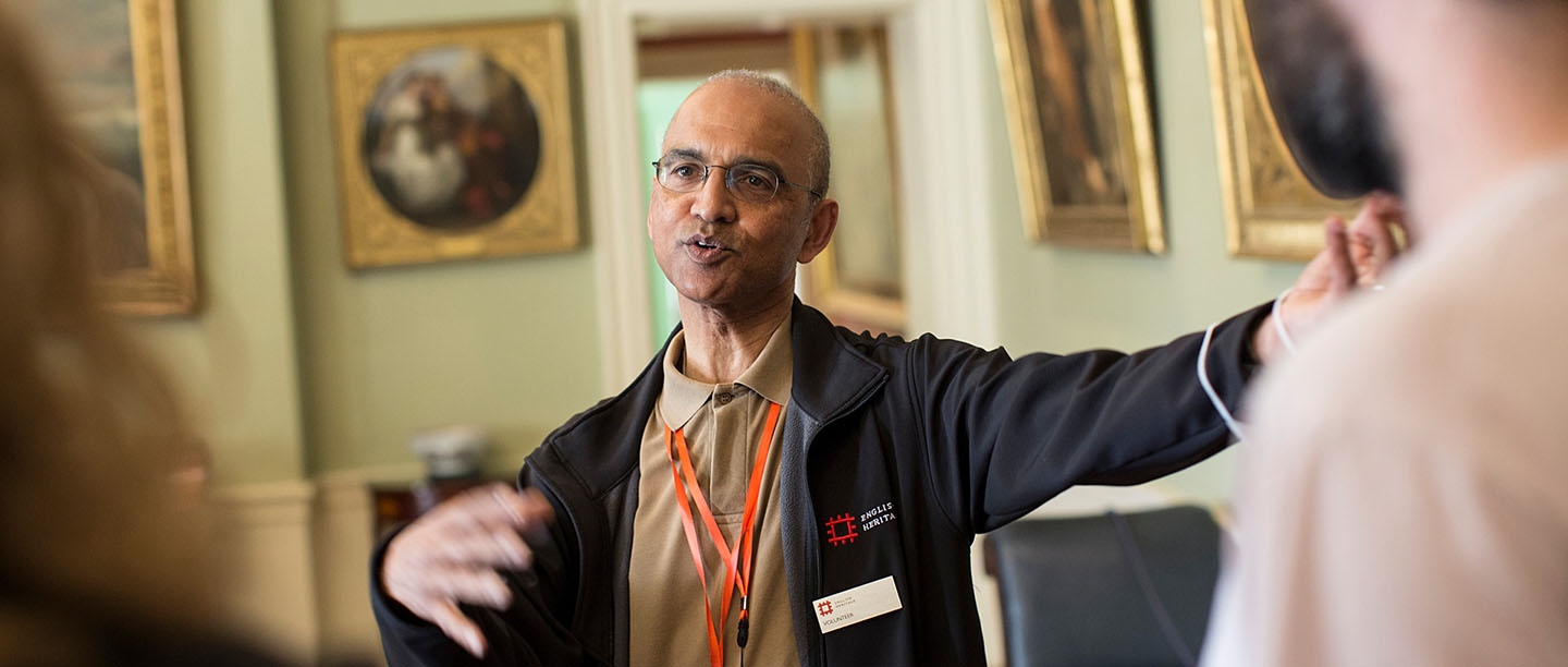 An English Heritage volunteer guides visitors